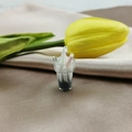 Detailed macro view of a miniature iridescent ice cream sundae resin charm for DIY crafts - Gray