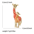 Golden giraffe mother and child brooch with vibrant red and orange enamel spots - Red