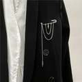 Detail of silver safety pin brooch with hanging chains and cone pendants on black blazer - Long Style (XZ1446)