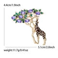 Elegant giraffe brooch with brown enamel and purple crystal in a golden finish - Brown