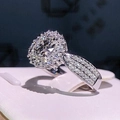 Luxury round halo diamond ring with triple-row pavé band in silver stainless steel - Size 5 / Silver