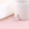 Close-up of gold-plated crane charm with white enamel and pink cherry blossom pattern - Right Side Style / White Paper Crane Style (YZ008)