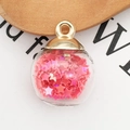 DIY charm featuring clear glass ball pendant filled with pink star sequins and gold cap - Rose Red
