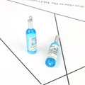 Set of two blue resin wine bottle charms with silver loops for DIY keychains and crafts - Blue