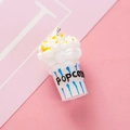 Resin popcorn charm featuring yellow cream detail and blue striped cup with POPCORN text - Blue Striped Popcorn (YZ135)
