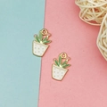 Detailed macro view of two green cactus charms with pink flowers for DIY jewelry making - Gold Dots Style (3)