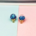 Detail of DIY star pattern glass ball pendants with blue sequins and gold base - Deep purple