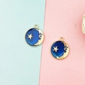 Detail view of round blue enamel charms with gold star and moon patterns for DIY jewelry making - Royal Blue Starry Sky