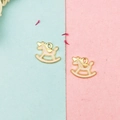 Detail of pink and white unicorn rocking horse pendants for DIY jewelry making - Pink