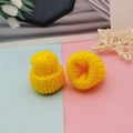 Detailed view of mini yellow knitted hats for DIY crafts and doll accessories - Yellow