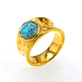 Close-up of hammered gold band ring featuring a round turquoise stone with natural textures - US 6 / Gold Turquoise