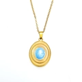 Macro view of gold sunburst pendant with blue marble inlay and fine link chain - Gold Blue Enamel