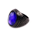 Macro shot of an oval blue gemstone set in a vintage engraved black steel ring - US 7 / Black Base Blue Gemstone