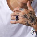 Detailed view of punk style chain link ring in dark blue and purple finish on hand - US 10 / Blue