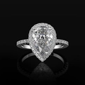 Macro detail of pear shaped halo ring with paved setting and cubic zirconia stones - US 6 / White Gold