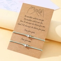 Star charm light blue braided couple bracelets on a kraft paper gift card - Blue