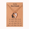 Detail view of Yin Yang koi fish pendants and friendship card necklaces on display - Golden Necklace