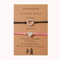 Detalle de pulseras de corazón para madre e hija en tarjeta de regalo kraft con mensaje - Rosa + Negro