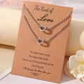 Silver love knot necklace set with display card on a minimalist elegant background - Necklace And Card / Steel Love Theme