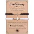 Detail of woven couple bracelets with silver cross charms on a vintage gift card - Anniversary Theme (Black & White)