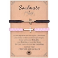 Matching braided cross bracelets for couples on Soulmate gift card packaging - Soulmate Theme (Black & Pink)