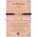 Close-up of woven couple bracelets with silver cross charms on gift message card - To My Love Theme (Black & Pink)