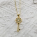 Exquisite gold key necklace with blue gemstone and zircon inlay on white lace background - Micro Pave Key Pendant Gold (Without Chain)