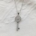 Detailed macro view of silver key necklace pendant with pave-set white cubic zirconia stones - Micro Pave Key Pendant White Zircon (Without Chain)