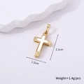 Detail view of gold cross pendant with white inlay and dimensions of 2.1cm by 1.2cm - Gold Style A