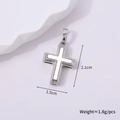 Detailed macro view of silver metal cross pendant with dimensions 2.1cm x 1.5cm - Silver Style F