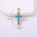 Macro shot showing 3.2cm religious cross pendant with blue opal and gold zircon stones - Bright Blue Opal Effect Inlaid Cross / Peacock Light Blue