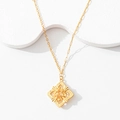 Detail of gold hollow floral pendant with starburst texture and asymmetric chain link - Stunning Beauty Necklace