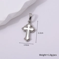 Detailed macro view of retro silver cross pendant with white enamel inlay and beaded edges - Silver Style J