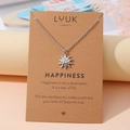 Collier argenté minimaliste avec pendentif étoile solaire sur carte cadeau avec citation - Petit Soleil Argenté (N00172)