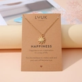 Collier avec pendentif soleil doré présenté sur carte kraft cadeau pour femme - Petit Soleil Doré (N00172)