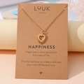 Goldener Herzanhänger mit Sonnenstrahlen auf Grußkarte mit emotionalem Text - Herz Pfote Gold (N00172)