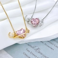 Close-up of pink heart gemstone Saturn necklace with crescent moon and star elements - Heart Planet Pendant Pink