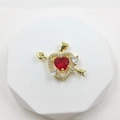 Detail of gold heart pendant with red zircon and sparkling cubic zirconia arrow design - Heart with Arrow / Gold