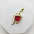 Macro shot of gold-plated red heart pendant with pave zircons and arrow detail - Arrow Through Heart (Detachable) / Gold