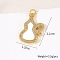 Macro detail of 18k gold plated gourd pendant with size markings and zircon inlay - Eared Gourd