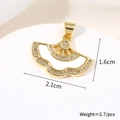 Macro shot showing dimensions of a gold fan-shaped pendant with white cubic zirconia crystals - Wave Fan