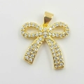 Elegant gold-plated bow pendant with sparkling cubic zirconia on a white background - Classic Bowknot Pendant (xu0001 Gold)