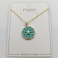 Detailed close-up of a blue enamel sunburst star pendant on a gold chain necklace - Blue Enamel Star Pendant With Chain And Box