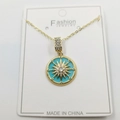 Detailed view of golden necklace featuring a starburst turquoise enamel pendant with crystals - Zirconia Octagram Enamel Pendant With Chain And Box