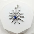 Silver sunflower pendant featuring a blue star center and spiral sunburst details - Silver Spiral Blue Star (Style Q)