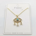 Golden Evil Eye necklace with turquoise center and teardrop pendants on white jewelry card - Teardrop Accented Style E / Pendant And Chain With Packaging