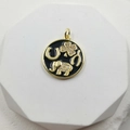 Macro detail of gold elephant pendant with enamel lucky symbols and zircon accents - Round Enamel Lucky Symbols Elephant Style