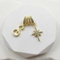 Detail of gold zircon necklace pendant featuring octagonal star and S-shaped charms - Script Letter S (Style 8)