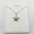 Elegant gold starfish pendant necklace with white cubic zirconia on white display card - Small Starfish Pendant with Chain and Packaging