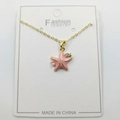 Golden starfish pendant necklace with pink enamel finish, pearls, and zircons on white card - Enamel Starfish Pendant with Chain and Packaging